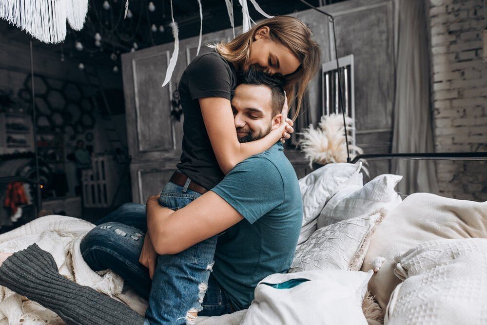 a woman embraces a man who increases potency